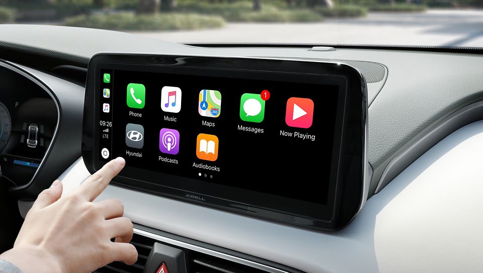 A Hyundai touchscreen display with the Apple Car Play icons displayed on the screen.