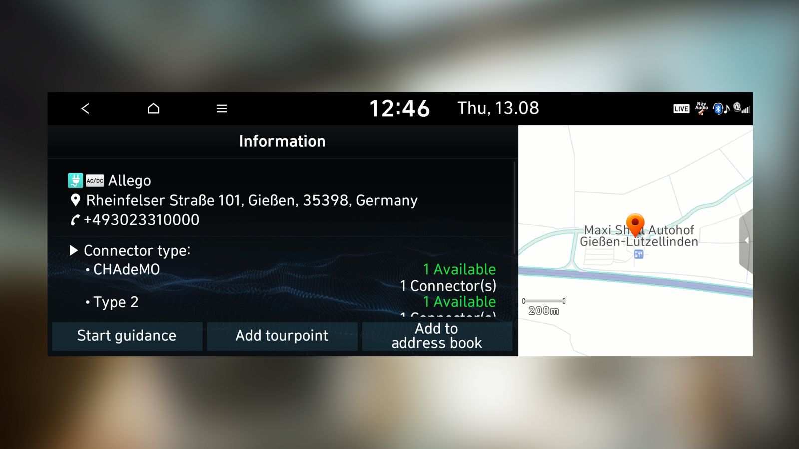 Screenshot of the Hyundai navigation system showing the closest charging station, available connectors.