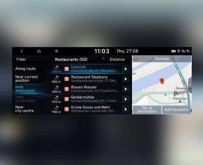 Screenshot of the Hyundai navigation system with a list of nearby restaurants.