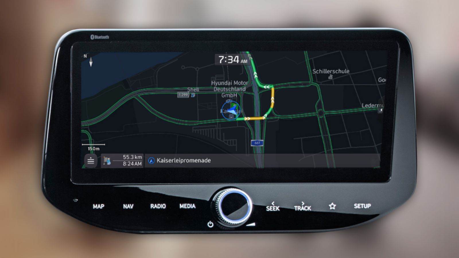 Close-up of a Hyundai touchscreen showing navigation with live traffic information.